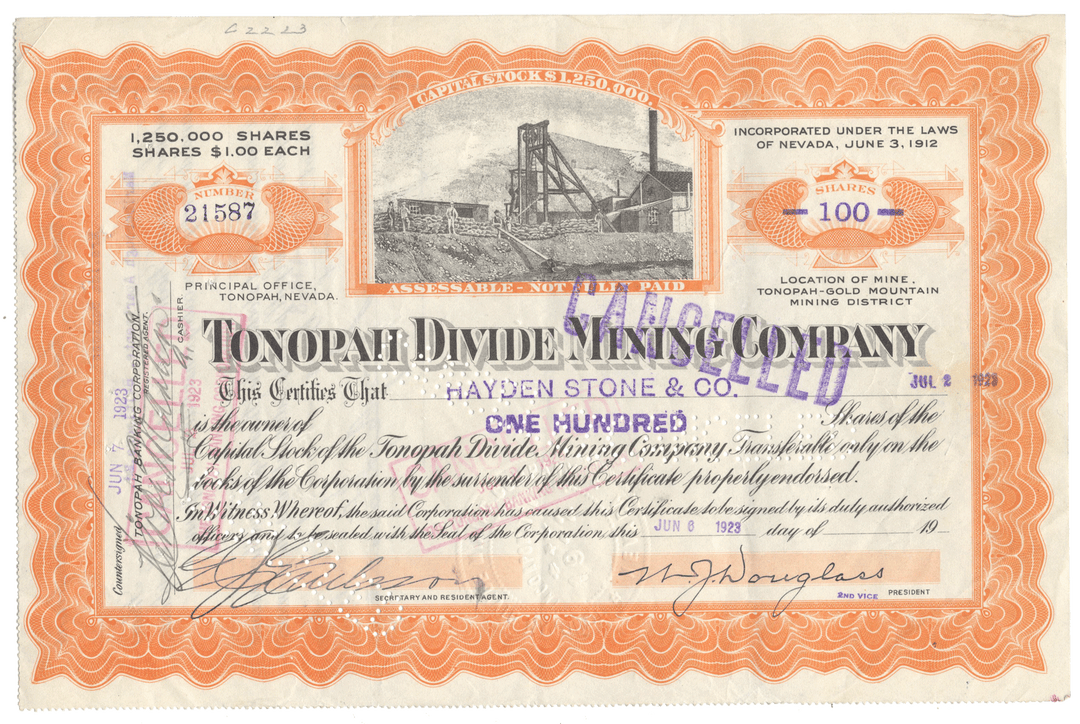 Vintage stock certificate for Tonopah Divide Mining Company with scenic illustration and text.