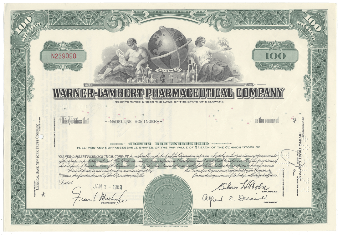 Stock certificate from Warner-Lambert Pharmaceutical Company with decorative elements and text.