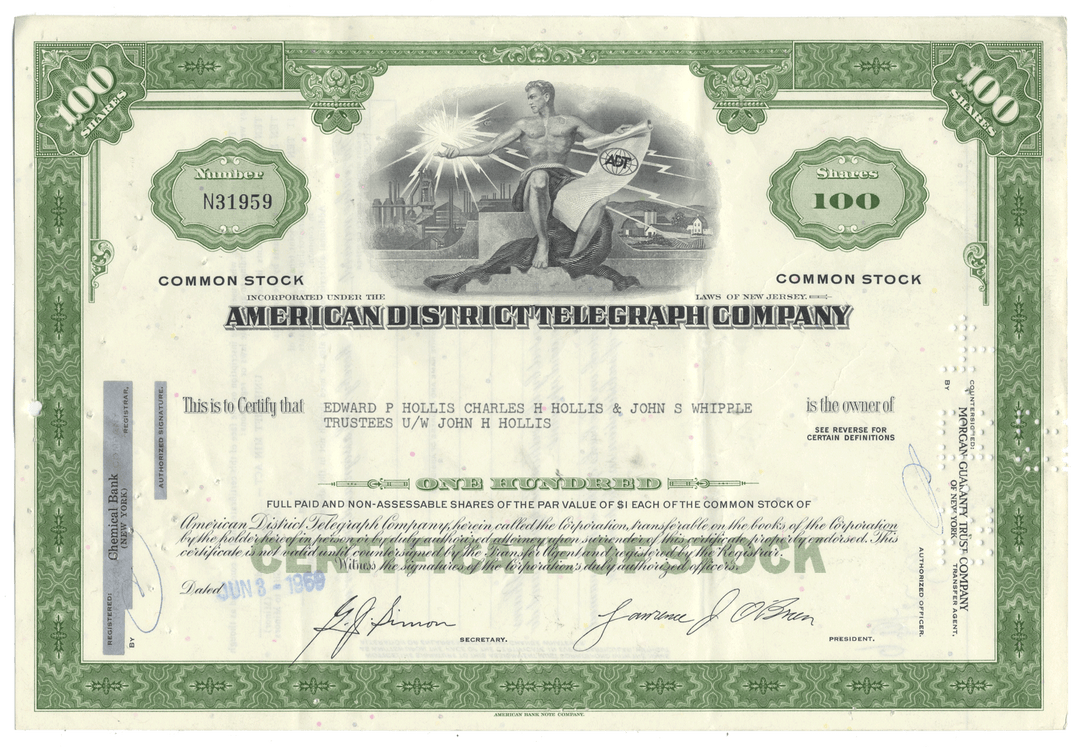 Vintage stock certificate of the American District Telegraph Company with green border and detailed design.
