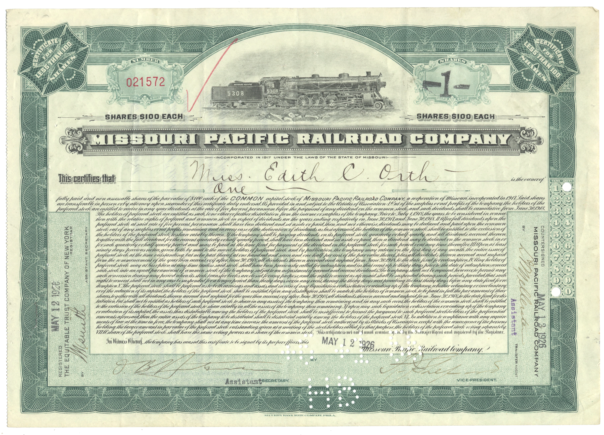 Share certificate of the Missouri Pacific Railroad Company with a train illustration on a green background.