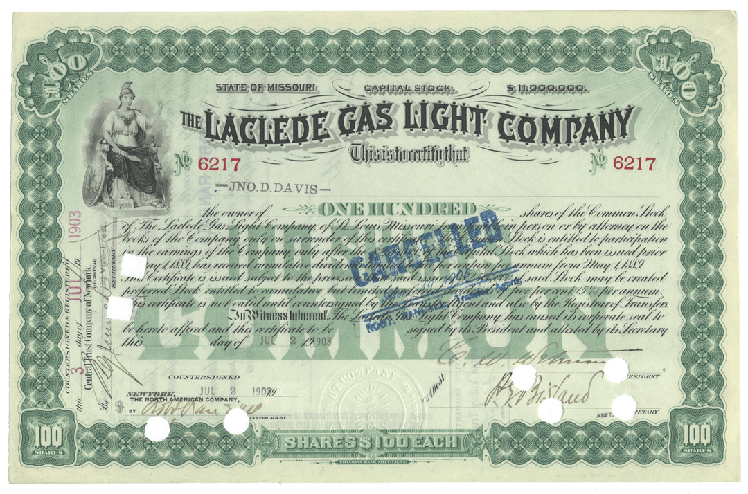 Historical stock certificate of the Laclede Gas Light Company with green border and text.