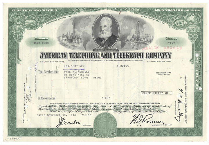Vintage stock certificate of American Telephone and Telegraph Company with a portrait and green border.