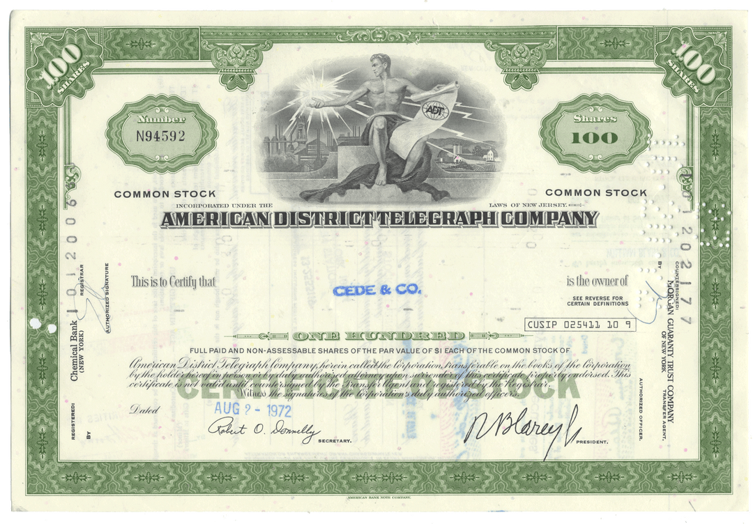 Vintage stock certificate of the American District Telegraph Company with a green border and black text.