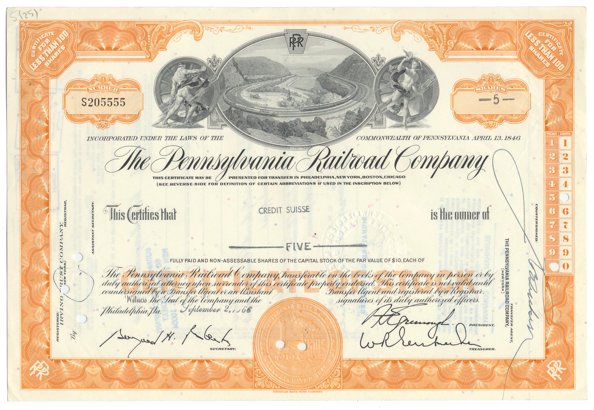 Historical stock certificate of the Pennsylvania Railroad Company with decorative elements and text.