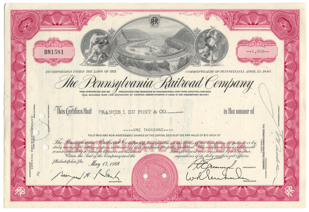 Historical stock certificate of the Pennsylvania Railroad Company with decorative elements and text.