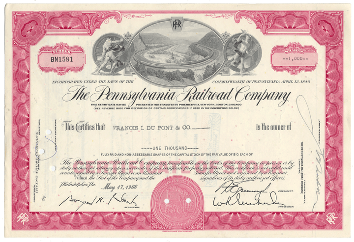 Historical stock certificate of the Pennsylvania Railroad Company with decorative elements and text.
