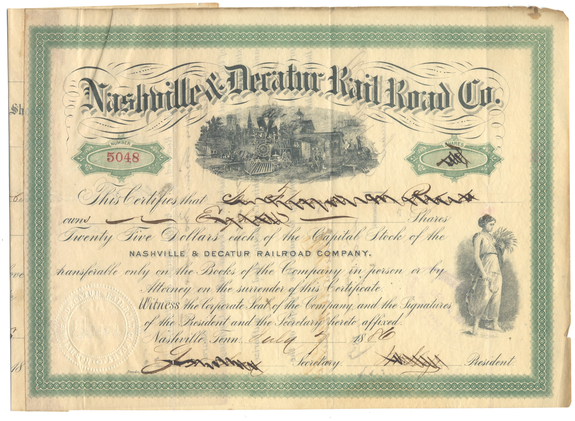 Nashville & Decatur Railroad Co. stock certificate with green border and black text.