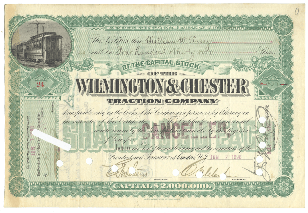 Vintage stock certificate for the Wilmington & Chester Traction Company with green design.