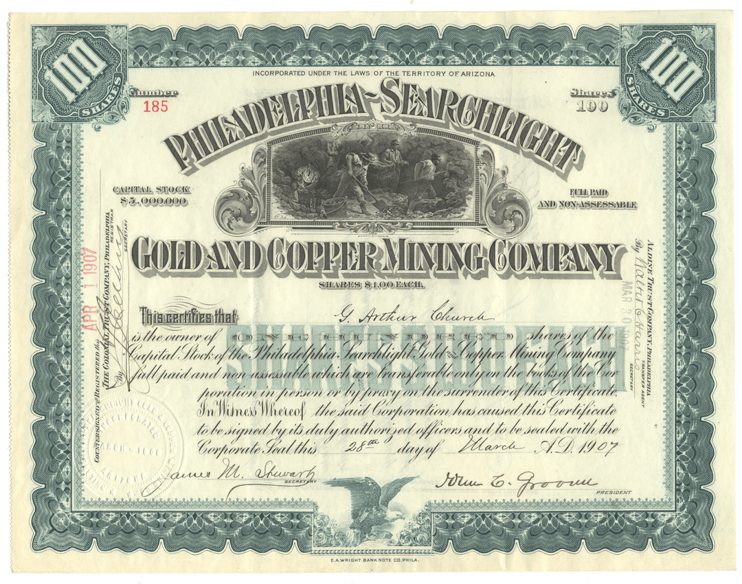 Stock certificate of the Philadelphia Searchlight Gold and Copper Mining Company with decorative elements.